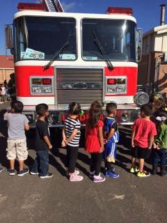Photo: Students Line up in front of a Fire Engine