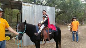 Photo: Boy Riding a Horse